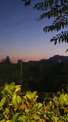 Dusk settling over trees and hills in Salerno
