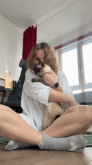 Woman's daily wellness routine includes yoga and cat time
