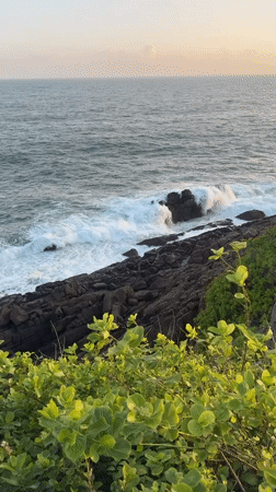 Ordinary beach day documented along Mirissa's rocky coastline