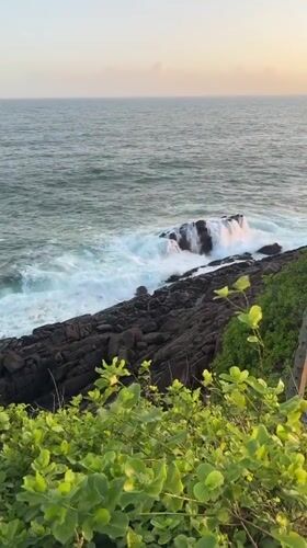 Ordinary beach day documented along Mirissa's rocky coastline