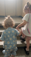 Children in pajamas walk through Bulgarian town streets
