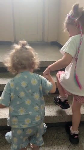 Children in pajamas walk through Bulgarian town streets