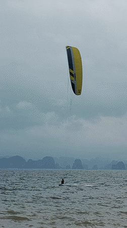 Kitesurfer glides across choppy waters in Bai Chay Ward