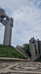 Grey concrete monument with gold elements documented in Bulgaria
