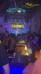 Live band performs at club venue serving food and drinks