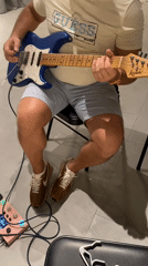 Guitar player spotted in casual indoor session, Choeng Thale