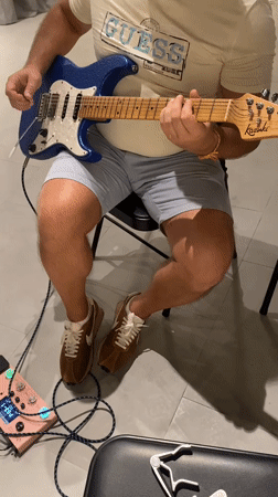 Guitar player spotted in casual indoor session, Choeng Thale