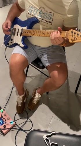Guitar player spotted in casual indoor session, Choeng Thale
