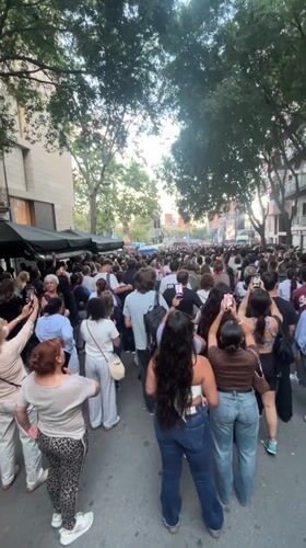 Crowd gathers in Barcelona to watch religious ceremony on outdoor screens