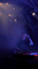 DJ set under colored lights at a Serbian nightclub