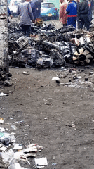 People gather at scrapyard in Nairobi auto parts market