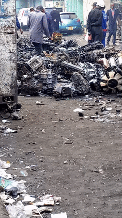 People gather at scrapyard in Nairobi auto parts market