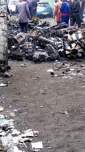 People gather at scrapyard in Nairobi auto parts market