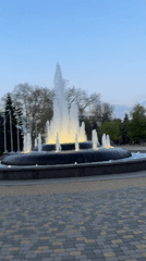 Urban waterfront scenes feature fountain, Ferris wheel during sunset hours