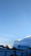 Backlit cloud formation observed over residential Nevinnomyssk, Russia