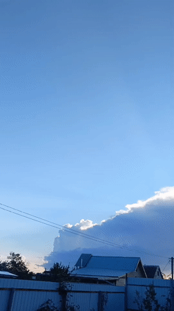 Backlit cloud formation observed over residential Nevinnomyssk, Russia