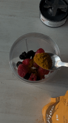 Young man makes berry smoothie, takes selfies in Mexico home