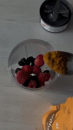 Young man makes berry smoothie, takes selfies in Mexico home