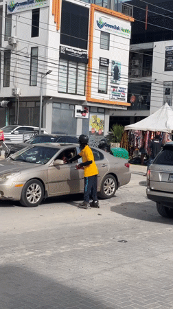 Rollerbladers navigate busy street in Lekki, Nigeria