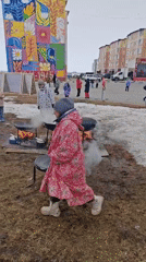 Community cooking event held outdoors in Ugolnye Kopi, Russia