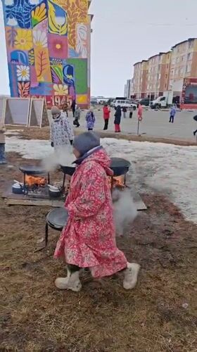 Community cooking event held outdoors in Ugolnye Kopi, Russia