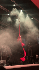 Aerial circus acts light up a smoky Tangier stage
