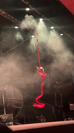 Aerial circus acts light up a smoky Tangier stage