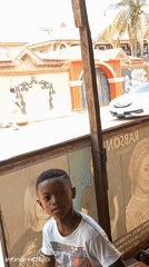 Ordinary street life documented across Nigerian neighborhoods during midday