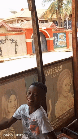 Ordinary street life documented across Nigerian neighborhoods during midday