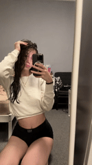 Woman takes mirror selfies in Sofia bedroom
