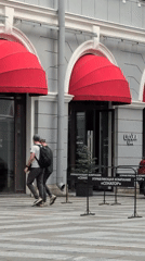 Street scenes around a red-awninged building in central Saint Petersburg