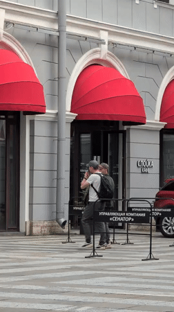 Street scenes around a red-awninged building in central Saint Petersburg