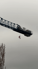 Blue crane displays UK flag in Laval, Canada