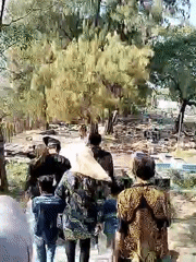 Community procession with music and traditional dress in Musuk