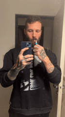 Man brushes teeth in Cordoba bathroom early morning