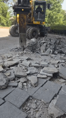 Komatsu excavator tears up concrete and asphalt in Leudelange