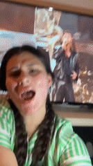 Woman films video at home in Kiryat Bialik