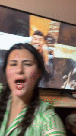 Woman films video at home in Kiryat Bialik