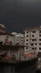 Overcast skies signal approaching storm in Dhaka neighborhood