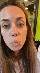 Woman enjoys burger at Belgrade restaurant with green walls