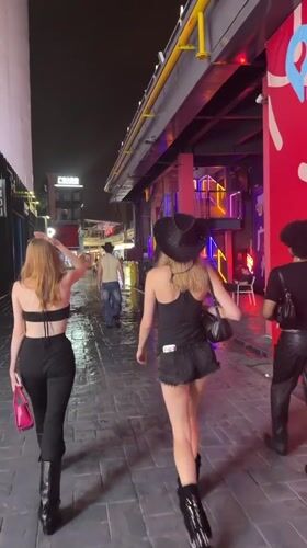 Night walk through a rain-slicked alley in Haizhu District