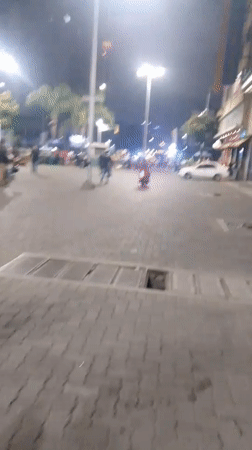 Nighttime street performers draw crowds in downtown Caracas