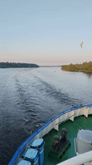 Ship passenger captures sunset, wake views near Sud'bitsy waters