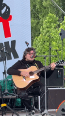 Daytime outdoor music performance draws crowd in Большая Кивара