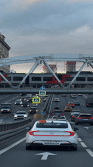 Moscow highway gridlock with elevated train passing above