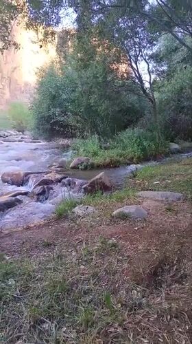 Turbulent river flows through rocky Akhmatabad landscape