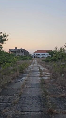Dawn sky colors captured on weathered path in Cam Ranh