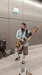 Guitar and metro train spotted in the same urban moment