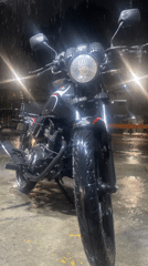 Motorcycle parked in the rain, Turmero, Venezuela