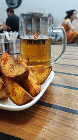 Crispy potato wedges and a cold beer at a Batumi restaurant